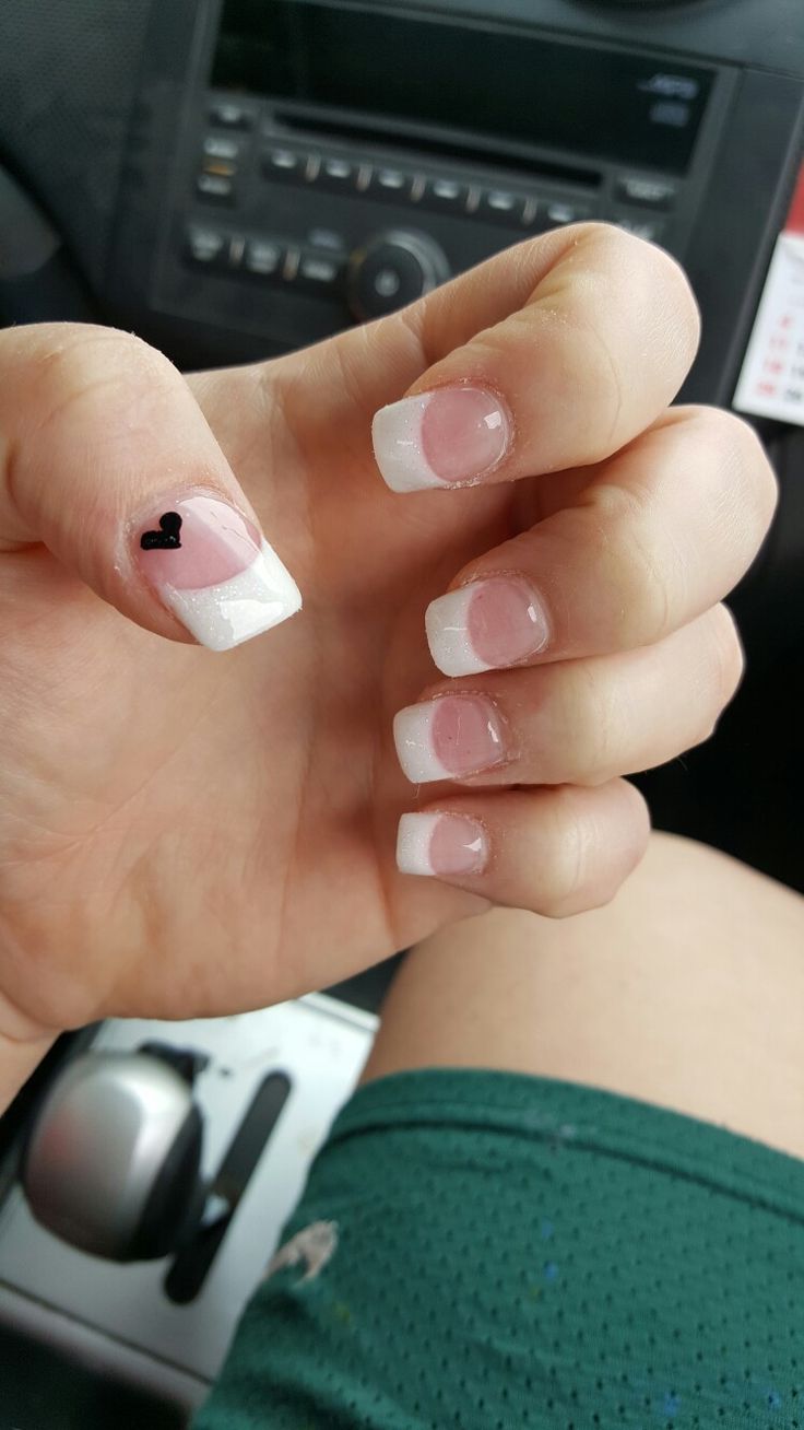 Chic French Tip Nails with Playful Heart Accent