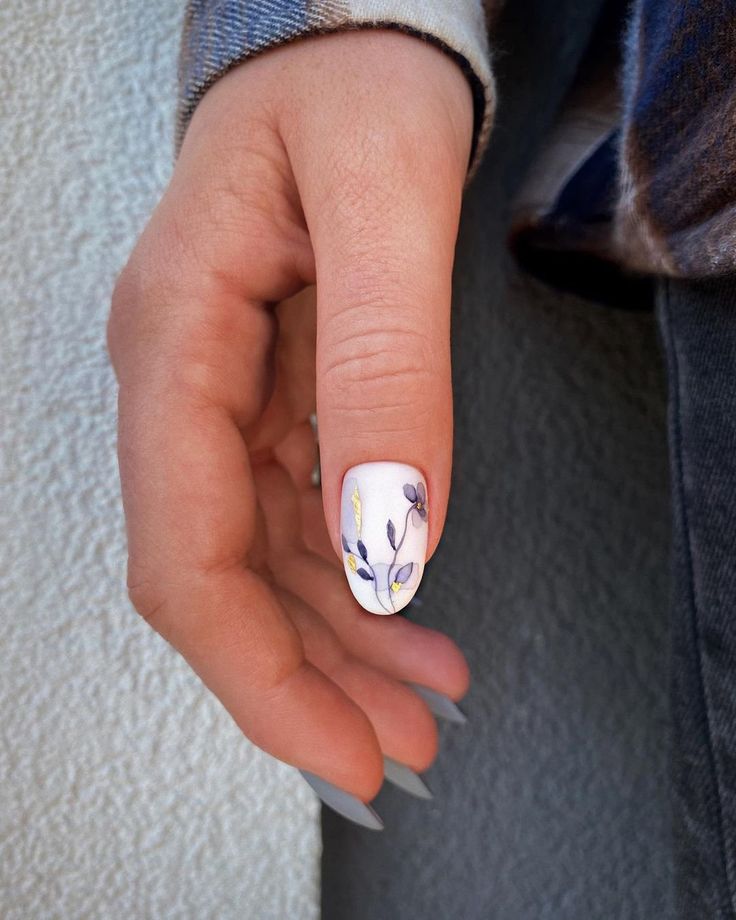 Elegant Floral Nail Art with Lavender and Yellow Blooms on a White Base.