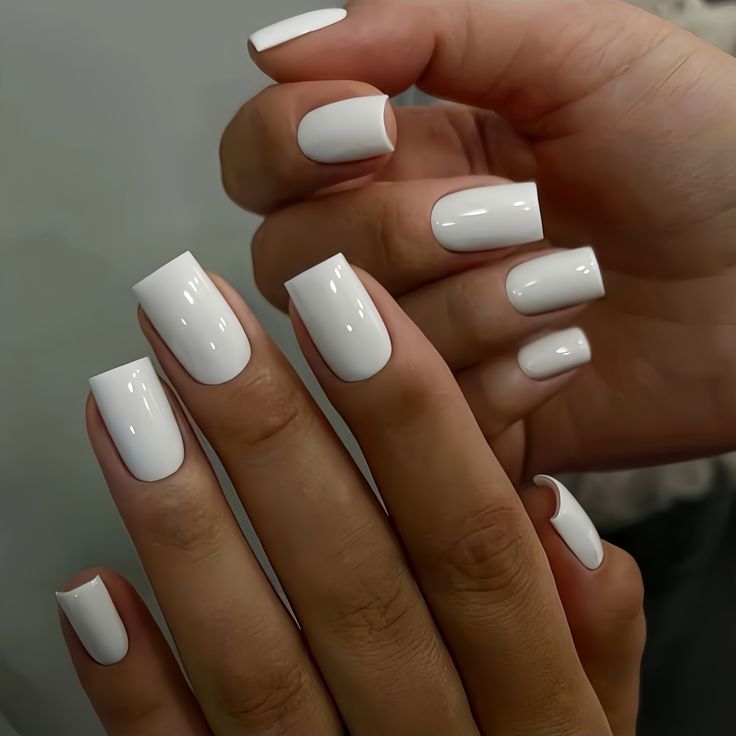 Sophisticated Glossy White Nail Design: A Minimalist Look for Any Occasion.