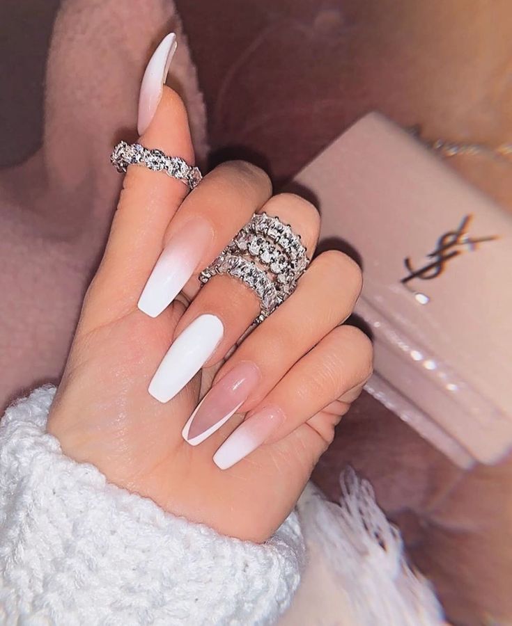 Sophisticated Stiletto Nail Design: White to Soft Pink Gradient with Sparkling Accents