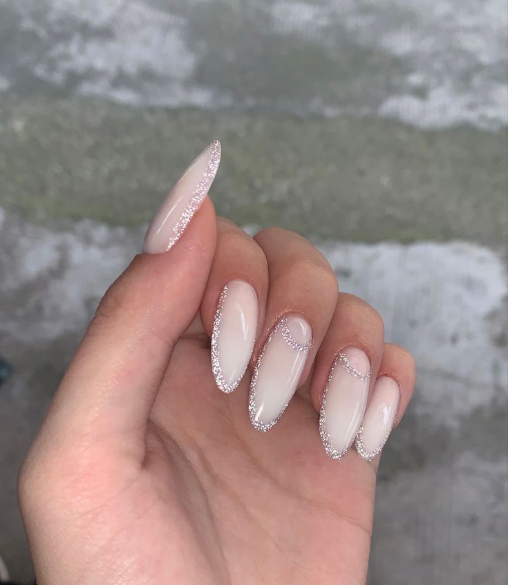 Sophisticated Nail Design: Nude Base with Glamorous French Tips