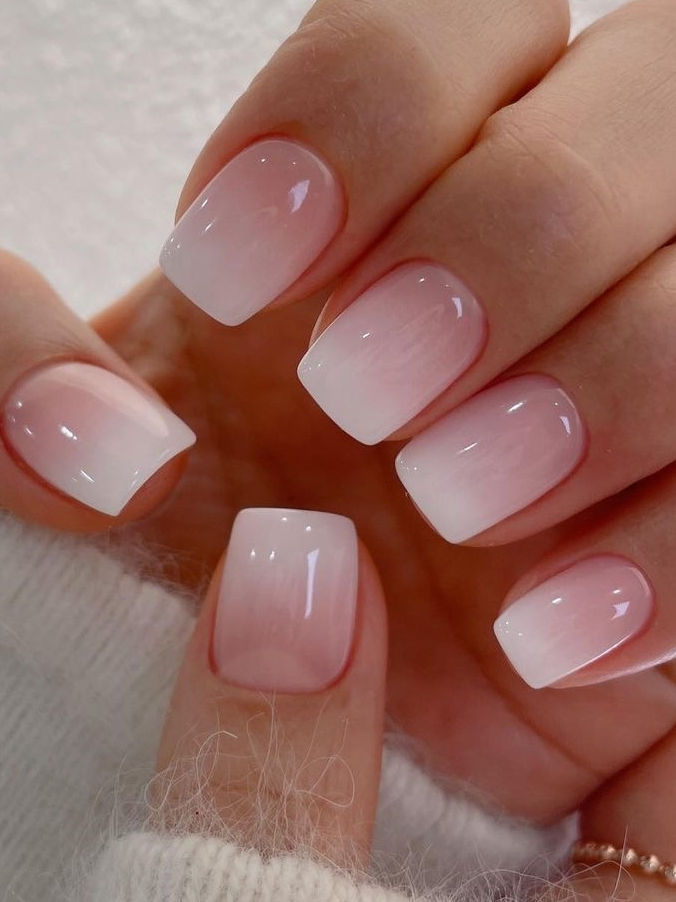 Elegant Ombre Nail Design: Soft Pink Transition with Sheer Finish for Versatile Chic.