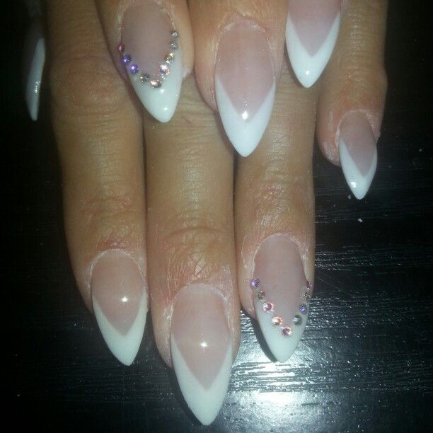 Elegant Almond-Shaped Nails with Glossy White Tips and Sparkling Gems