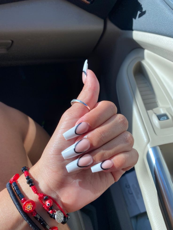 Chic Nail Design: Classic White Tips with Modern Negative Space and Glossy Finish