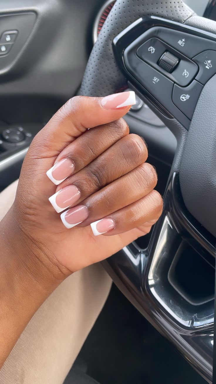 Chic French Manicure: Soft Nude Base with Crisp White Tips for Sophisticated Elegance.