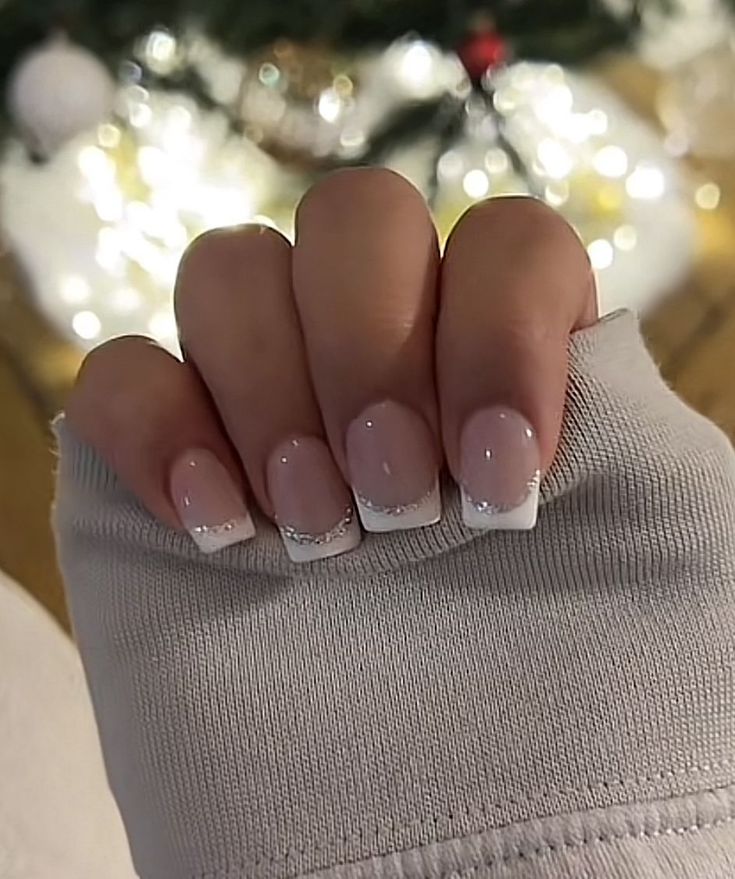 Sophisticated Nude French Tip Manicure with Glitter Accents