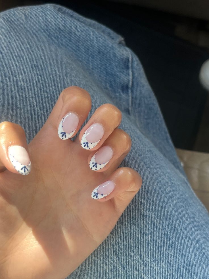 Elegant Soft Pink Nails with Intricate Blue Floral Tips