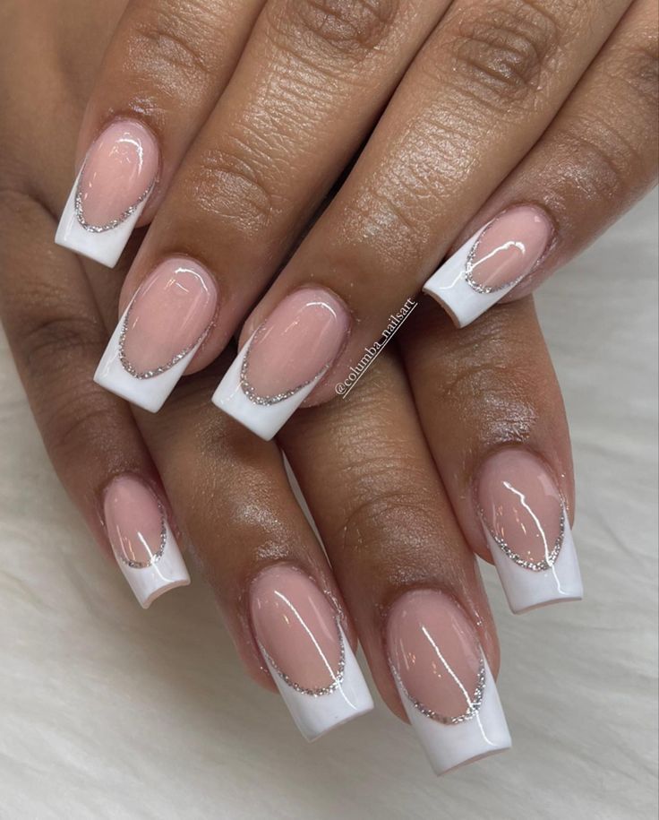 Elegant French Tip Nails: Classy White and Pink Base with Sparkling Silver Accents.