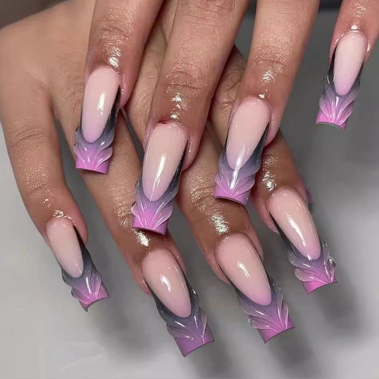 Elegant Gradient Nail Design with Elongated Tips and Delicate Patterns.