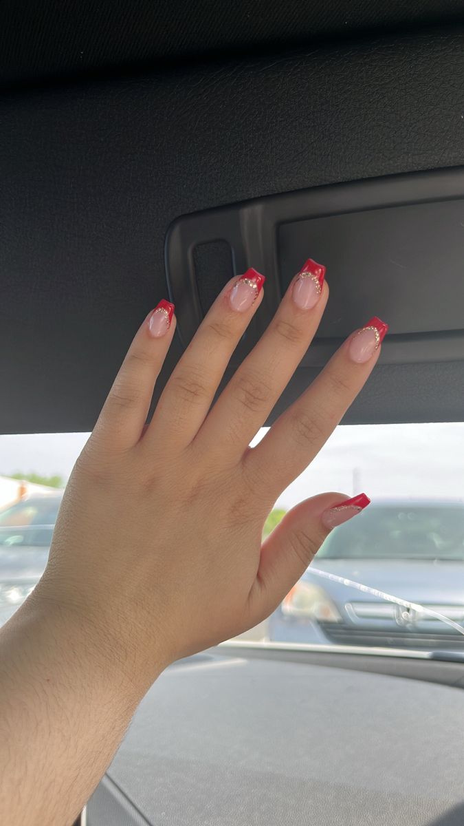 Chic French Tip Nail Design with Soft Pink and Bold Red Accents.