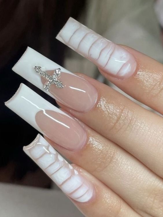 Elegant Long Square Nail Art with Glossy White, Nude Tones, Ribbed Lines, and Rhinestone Accent.