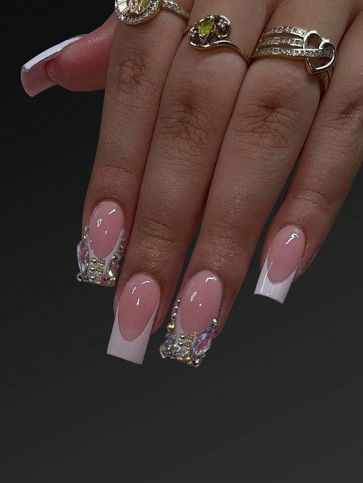 Chic Acrylic Nail Design: Soft Pink and French White Tips with Rhinestone Accents.