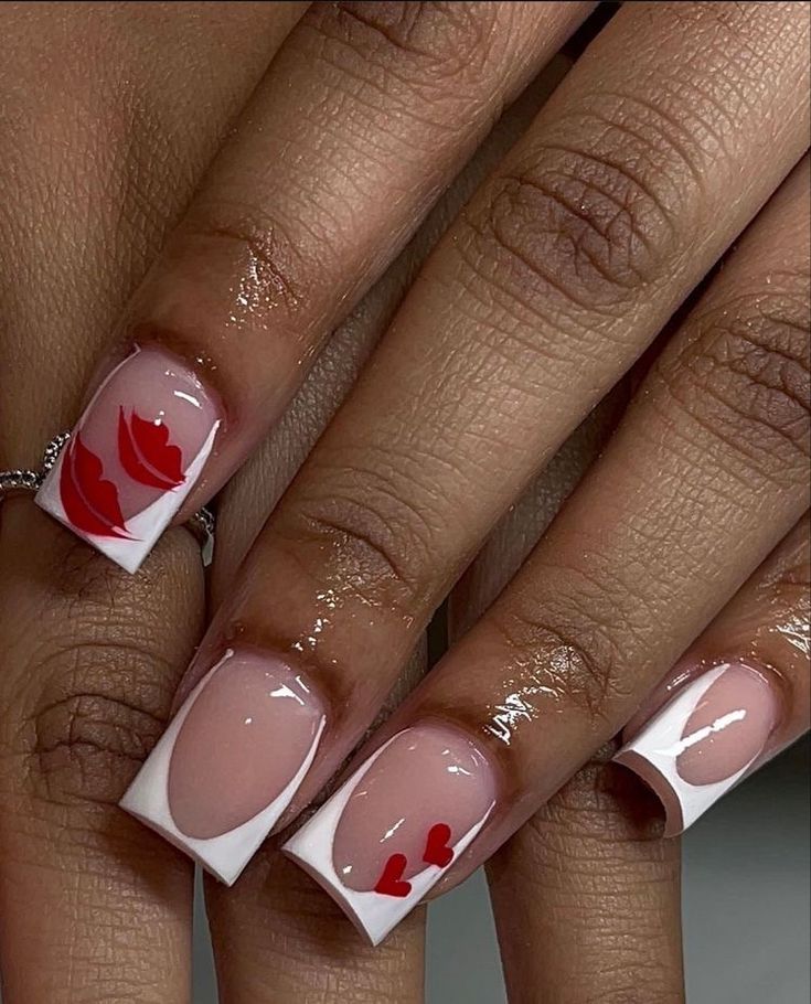 Playful Romantic Nail Design with Bold Kiss Marks and Heart Shapes on Chic Nude Base