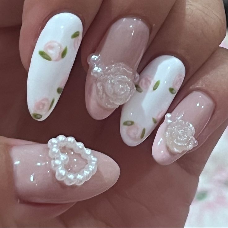 Romantic Floral Nail Art: Soft Pink Roses and Pearls with Elegant 3D Accents.