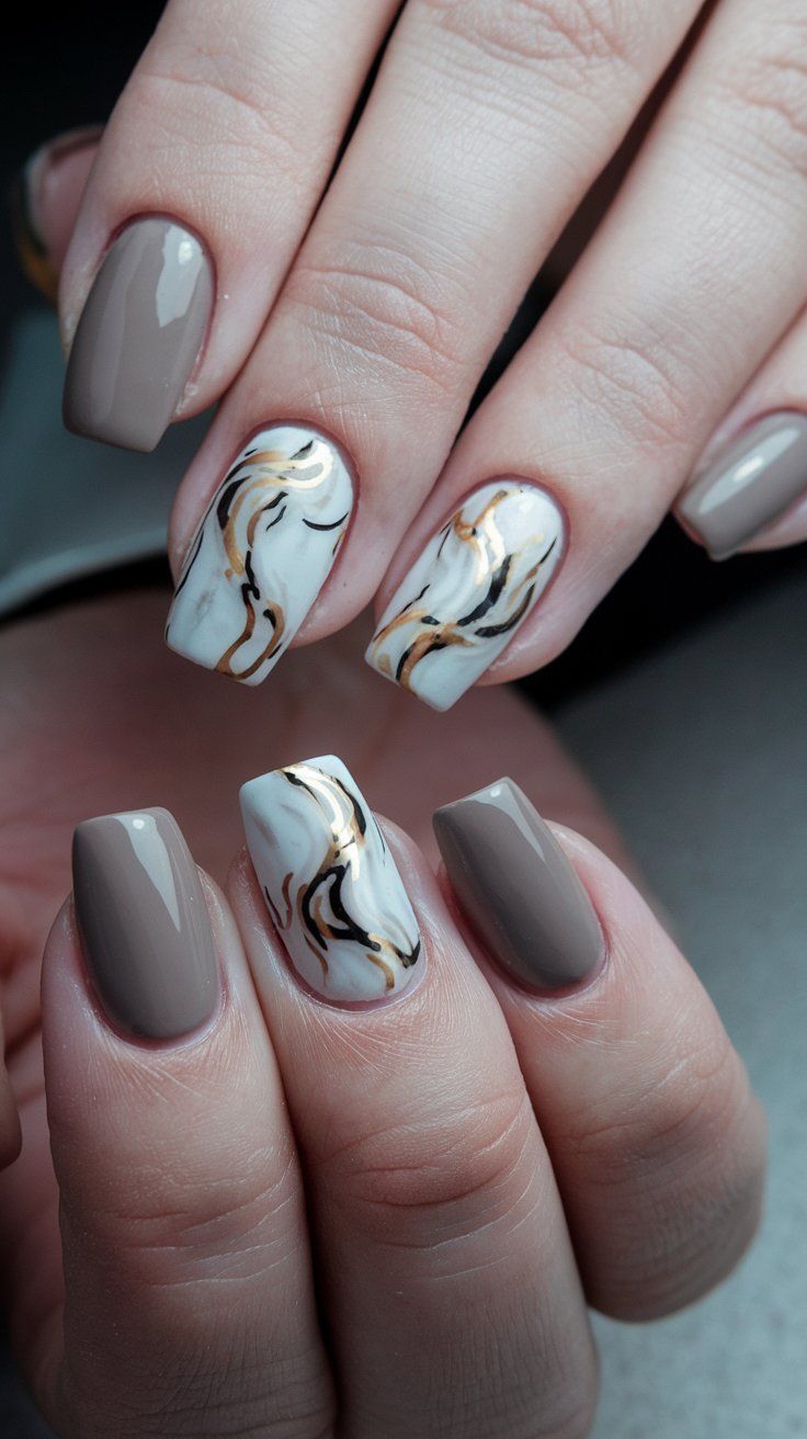 Sophisticated Taupe and Marble Nail Design with Gold Accents.