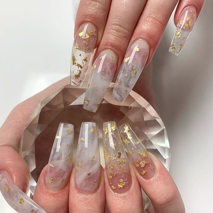 Translucent Marble Nail Design with Soft Pink Hue and Gold Flakes