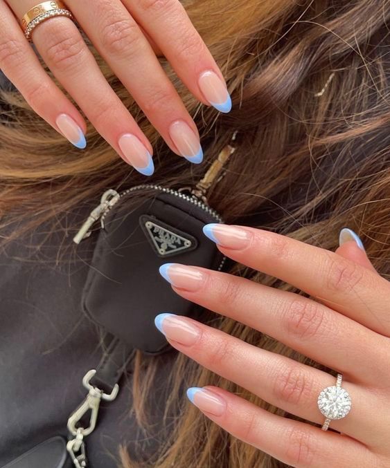 Elegant Almond-Shaped Nails: A Modern Twist on French Manicure with Soft Nude Base and Pastel Blue Tips