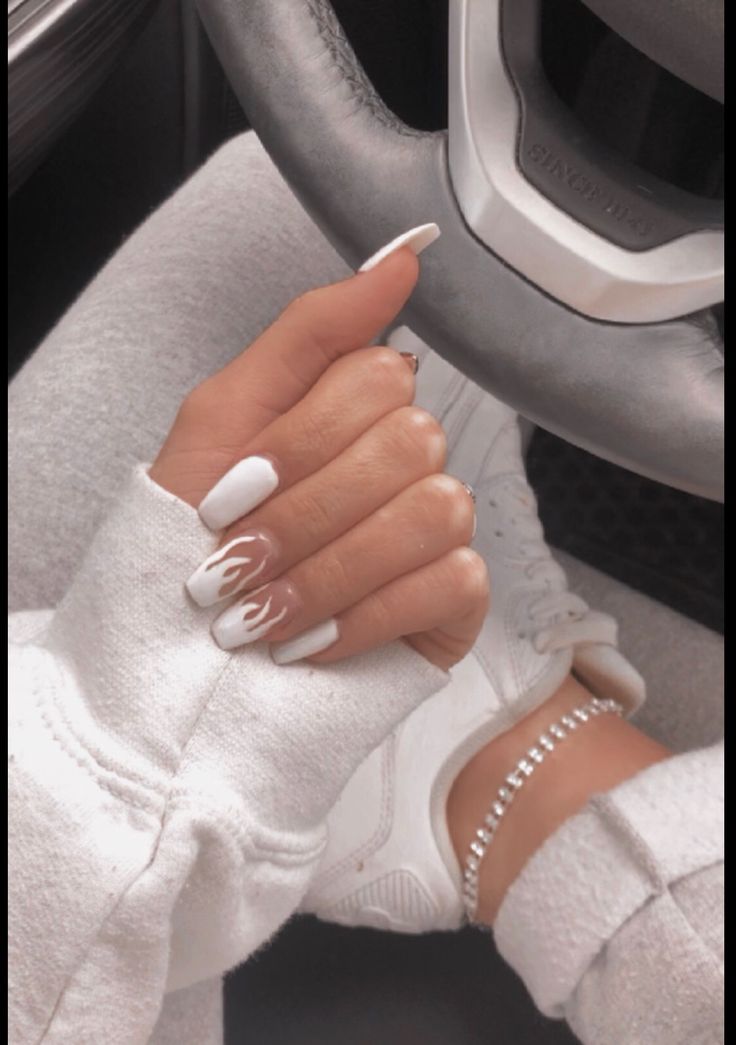 Chic White Nail Design with Unique Flame Accents for Effortless Style.