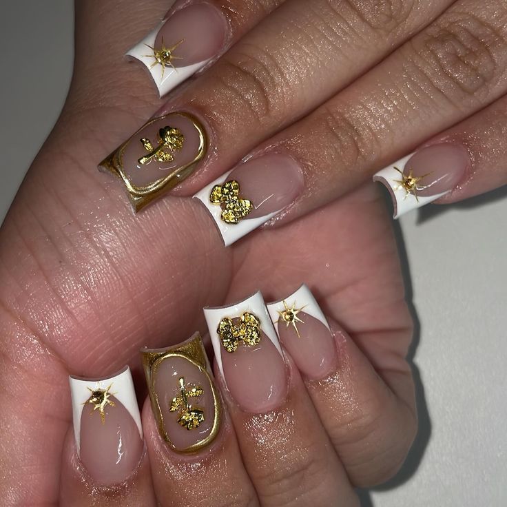 Sophisticated Nude and White Tip Nails with Glamorous Gold Foil Accents.