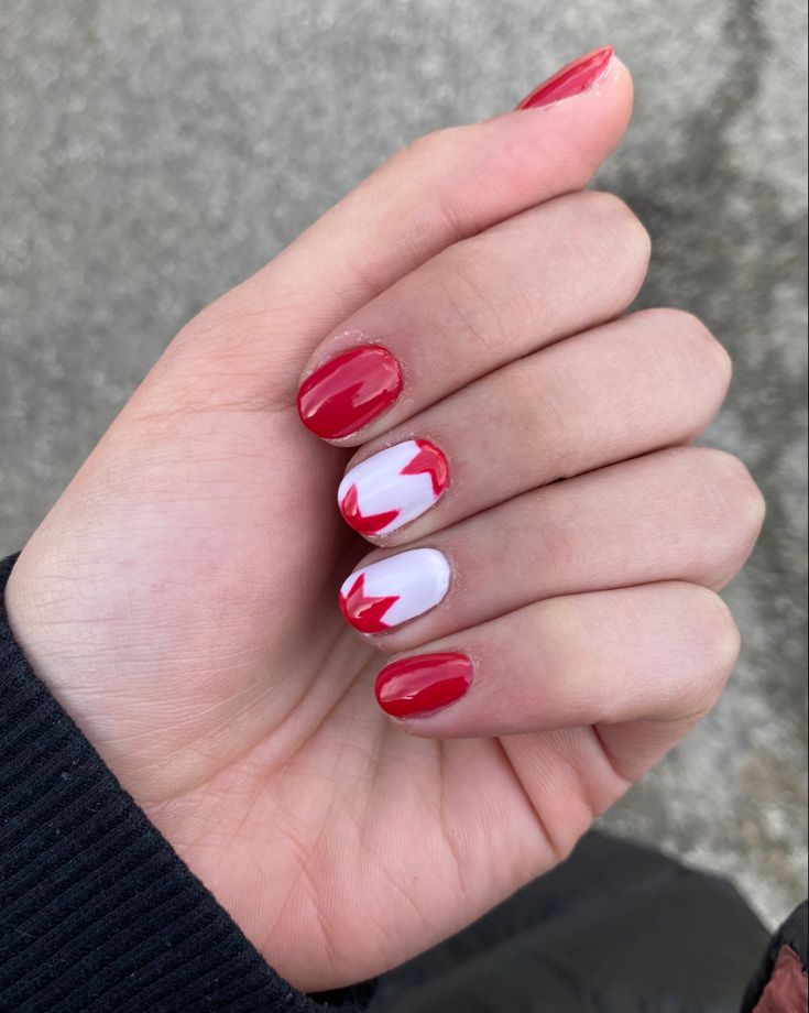 Vibrant Red and White Nail Design: A Playful Yet Elegant Statement for Festive Occasions.