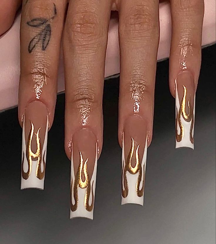 Dramatic Bold Flame Nail Design with Nude, White, and Gold Accents