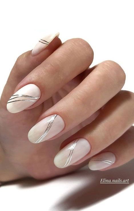 Chic and Sophisticated Nail Design with Soft Nude Base and Delicate Silver Lines