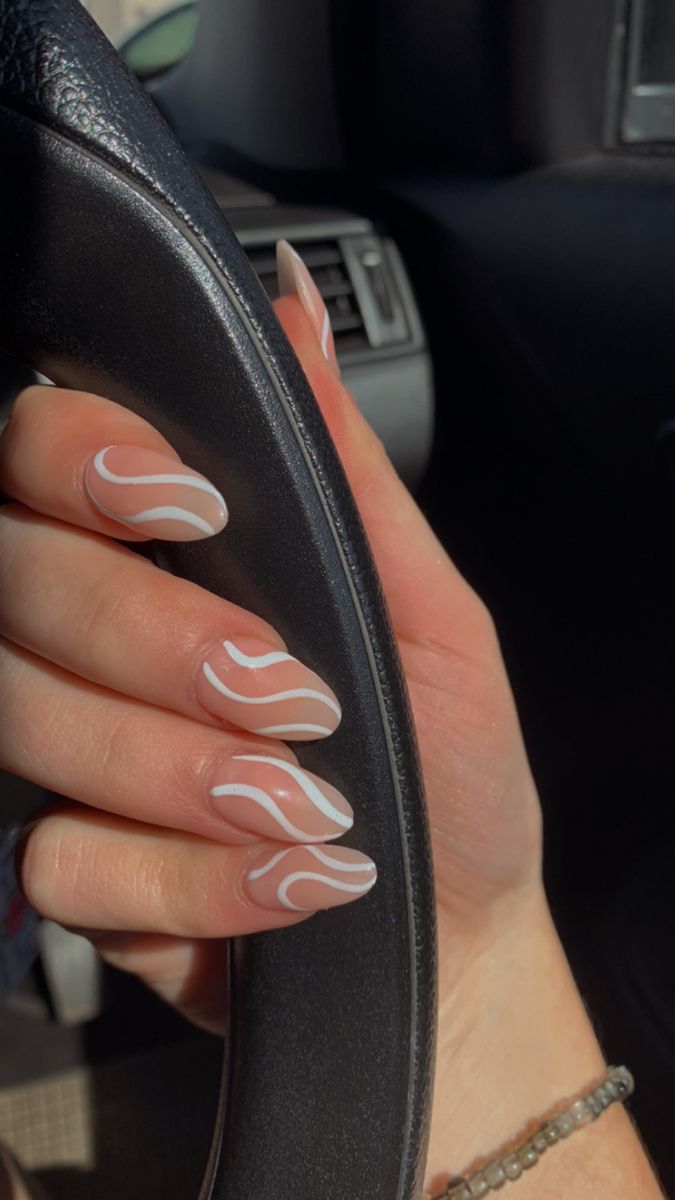 Chic Nude Nail Design with Wavy White Stripes: A Minimalist Touch for Modern Elegance.