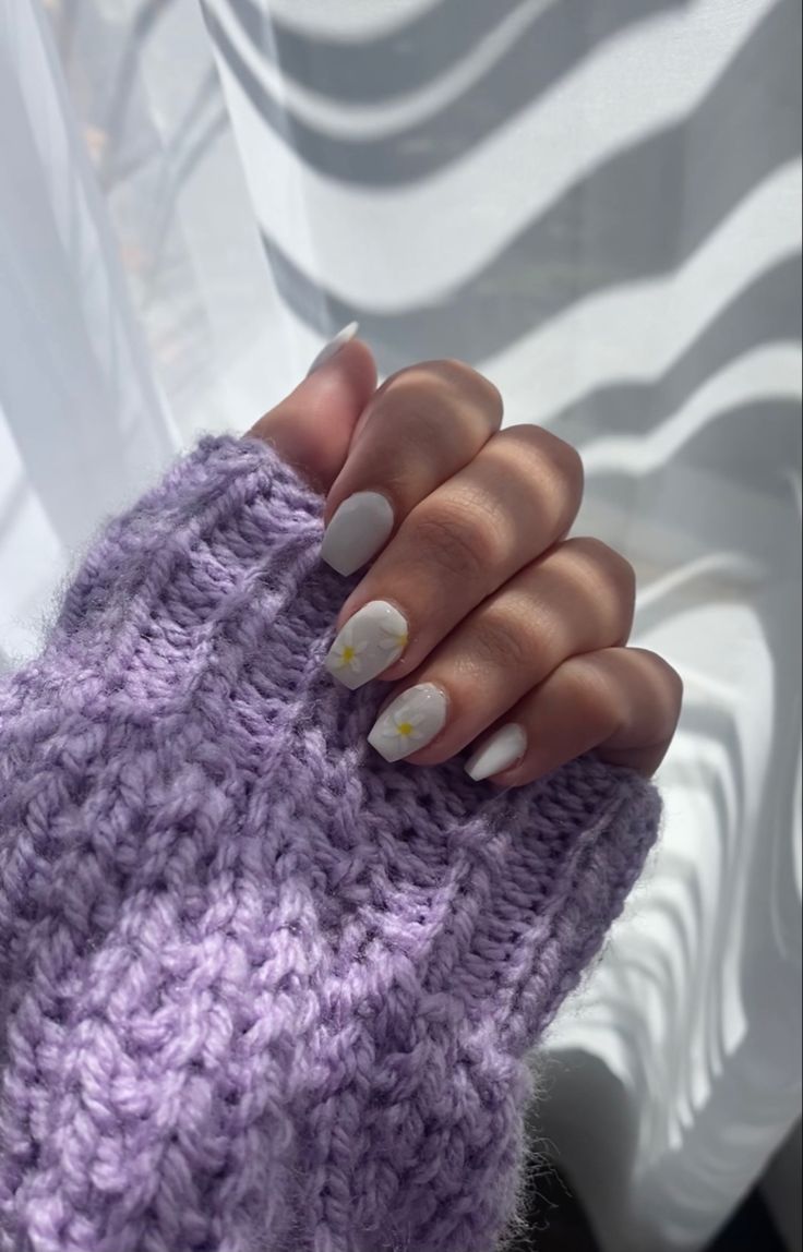 Charming Pastel Nail Design with Yellow Floral Accents Complements Cozy Lavender Sweater.