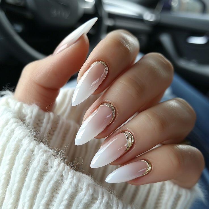 Elegant Almond-Shaped Ombre Nails with Gold Accents