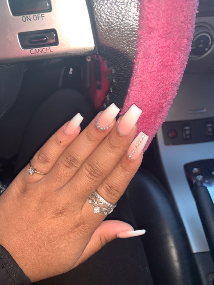 Chic Pink and White Ombre Nails with Glossy Finish and Rhinestone Accents.