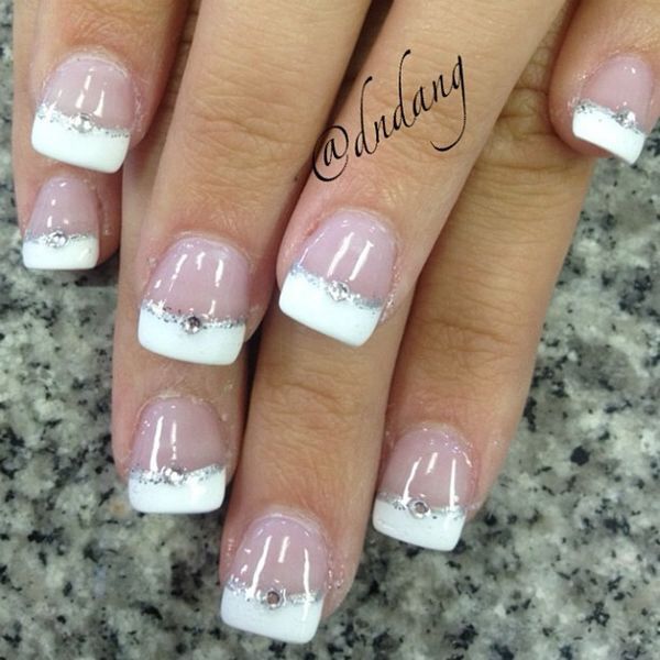 Sophisticated French Manicure: Classic White Tips with Silver Accents and Subtle Pink Base.