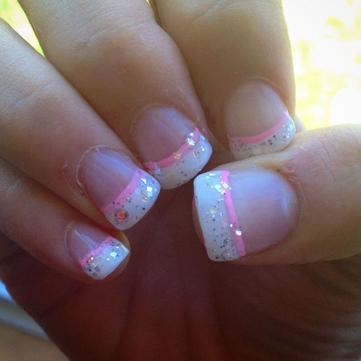 Elegant French Manicure with Sparkling Finish and Pink Accents