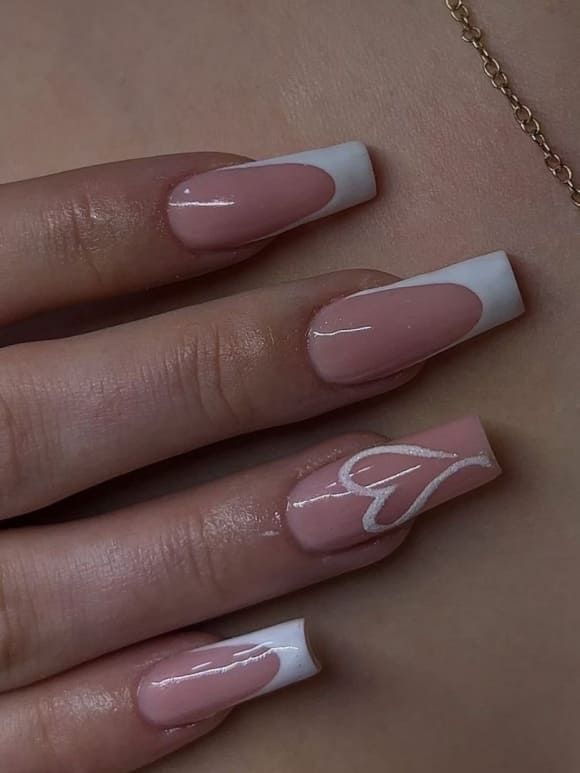 Chic French Tip Nail Design: Soft Pink and Pristine White with Heart Accent