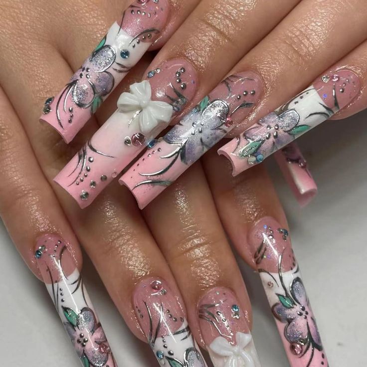 Sophisticated Pastel Pink and White Floral Nail Design with Sparkling Accents.