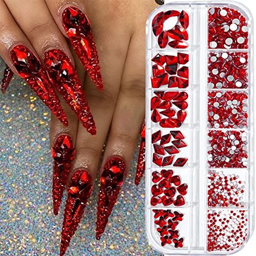 Glamorous Red Stiletto Nails Adorned with Sparkling Rhinestones for Stunning Impact.