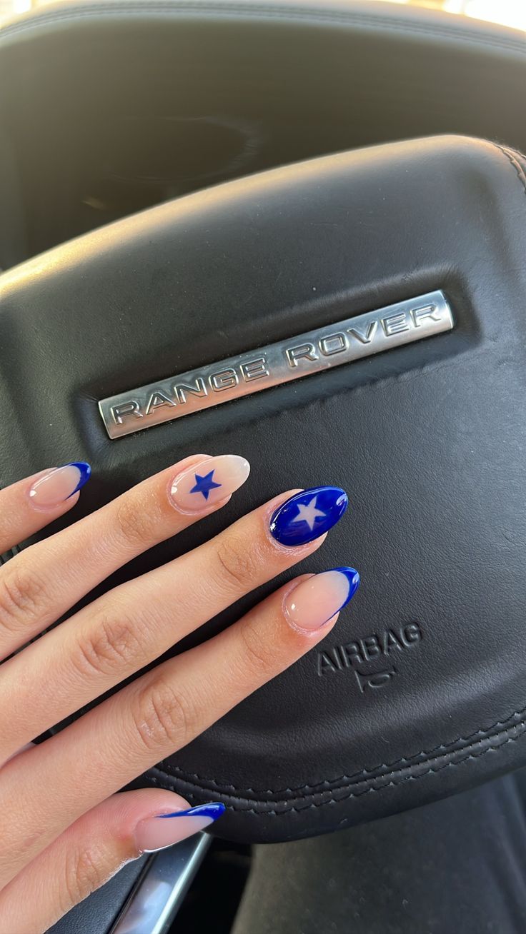 Chic Blue and Nude Nail Design with Shimmering Tips and Whimsical Stars.