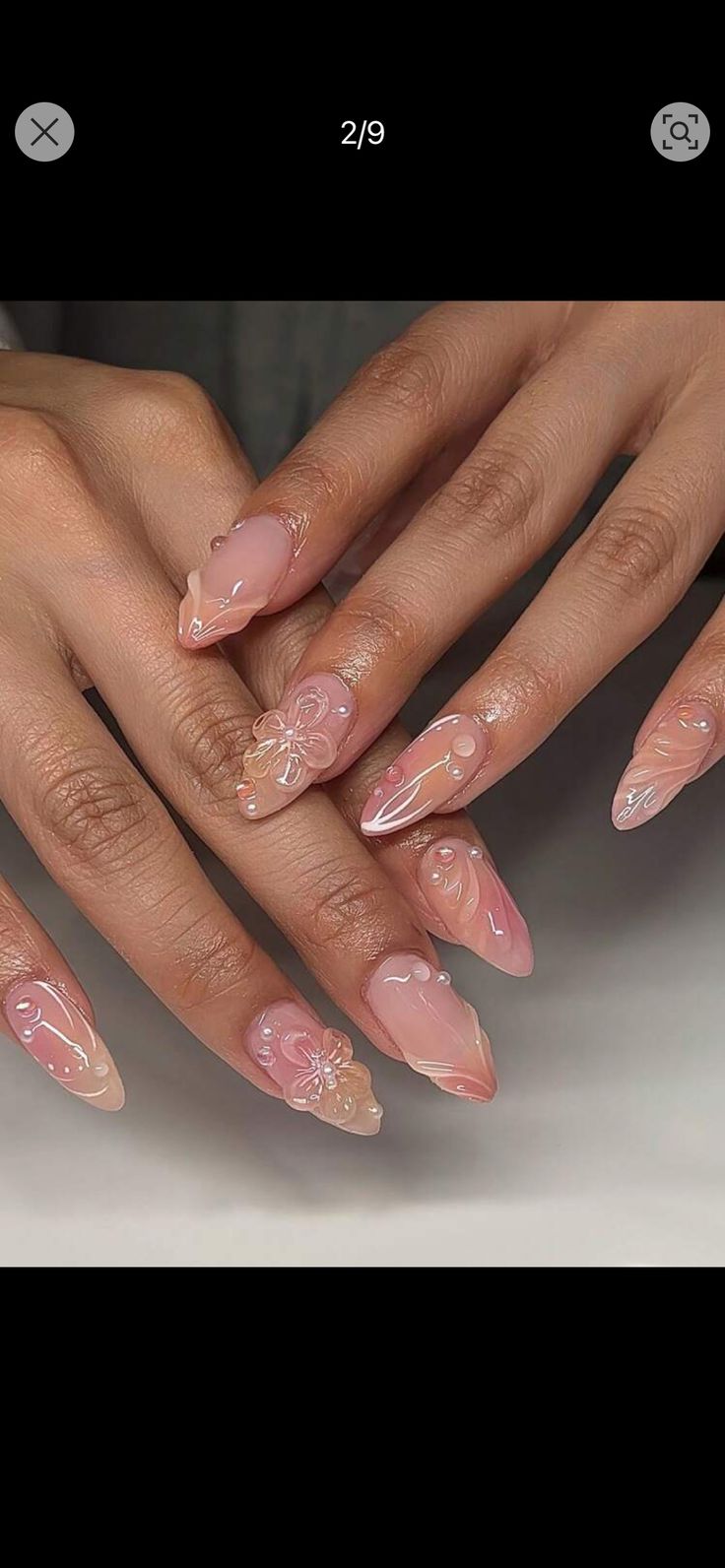 Elegant Almond-Shaped Nails with Soft Nude-Pink Gradient and Floral Accents.