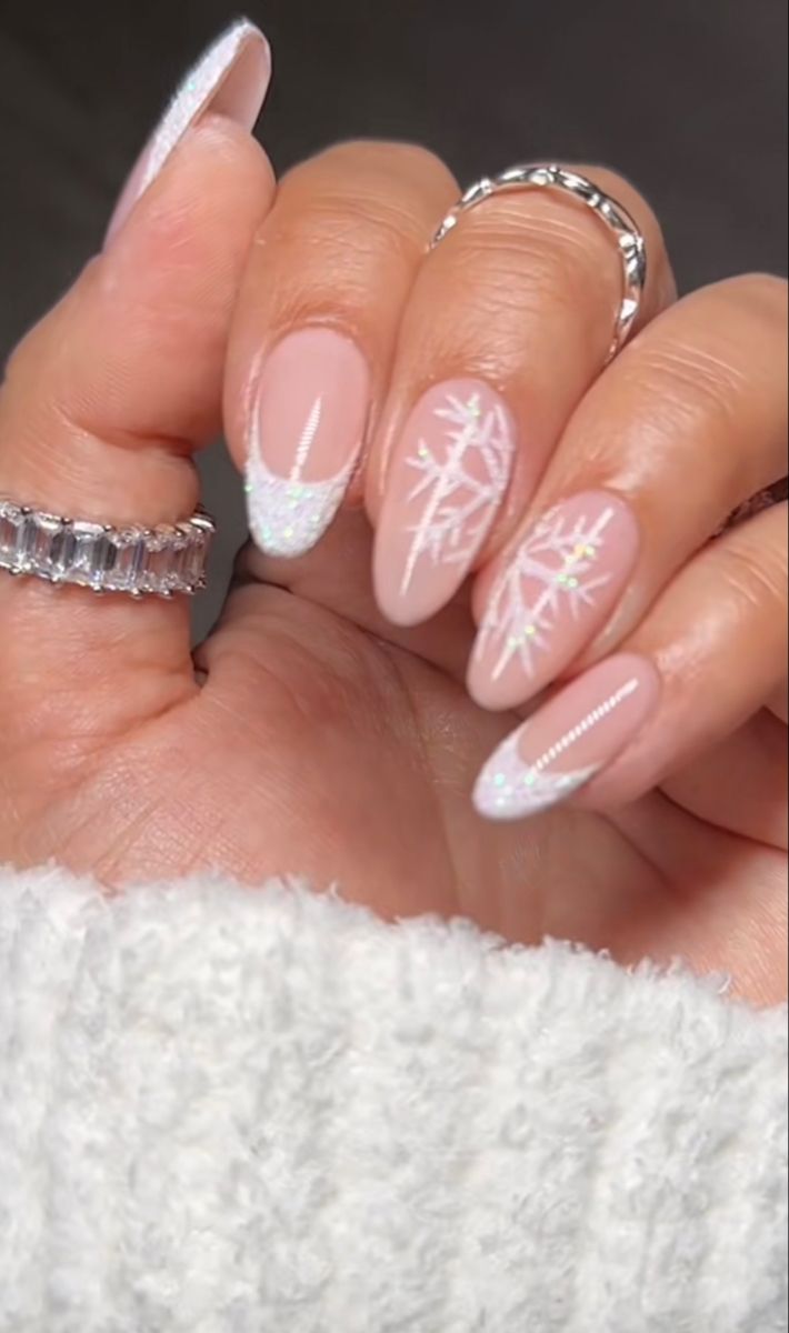 Sophisticated Soft Pink Nail Design with Seasonal Snowflake Patterns and Iridescent Accents