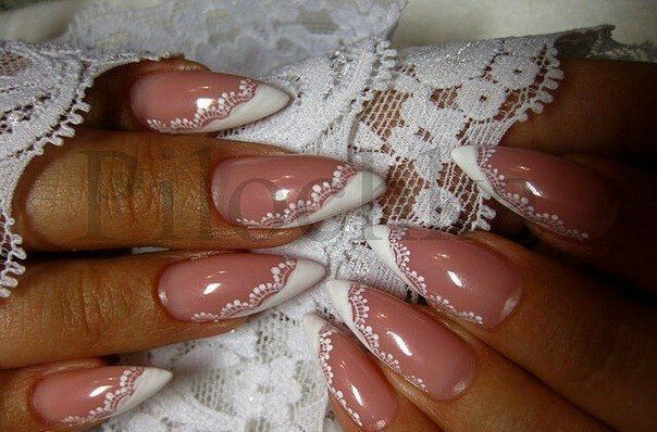 Sophisticated Almond-Shaped Nails with Soft Pink Base and Delicate White Lace Accents