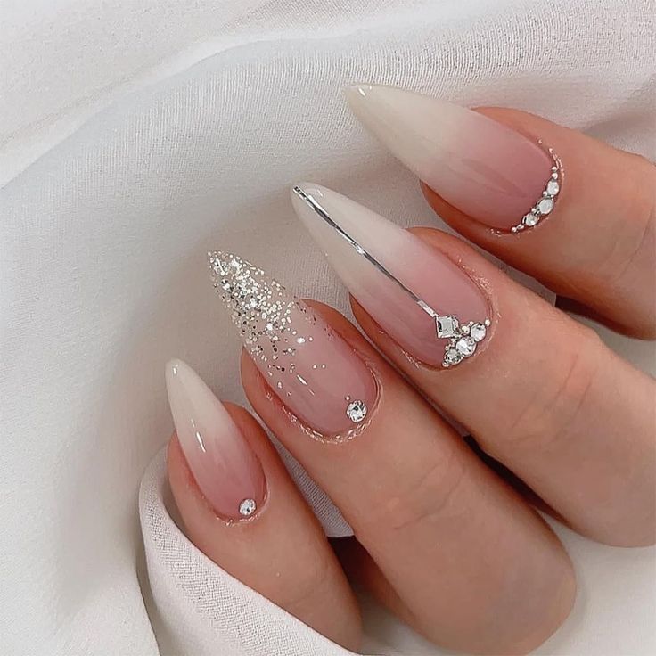 Sophisticated Gradient Nail Design with Glitter and Rhinestone Accents for Chic Occasions.