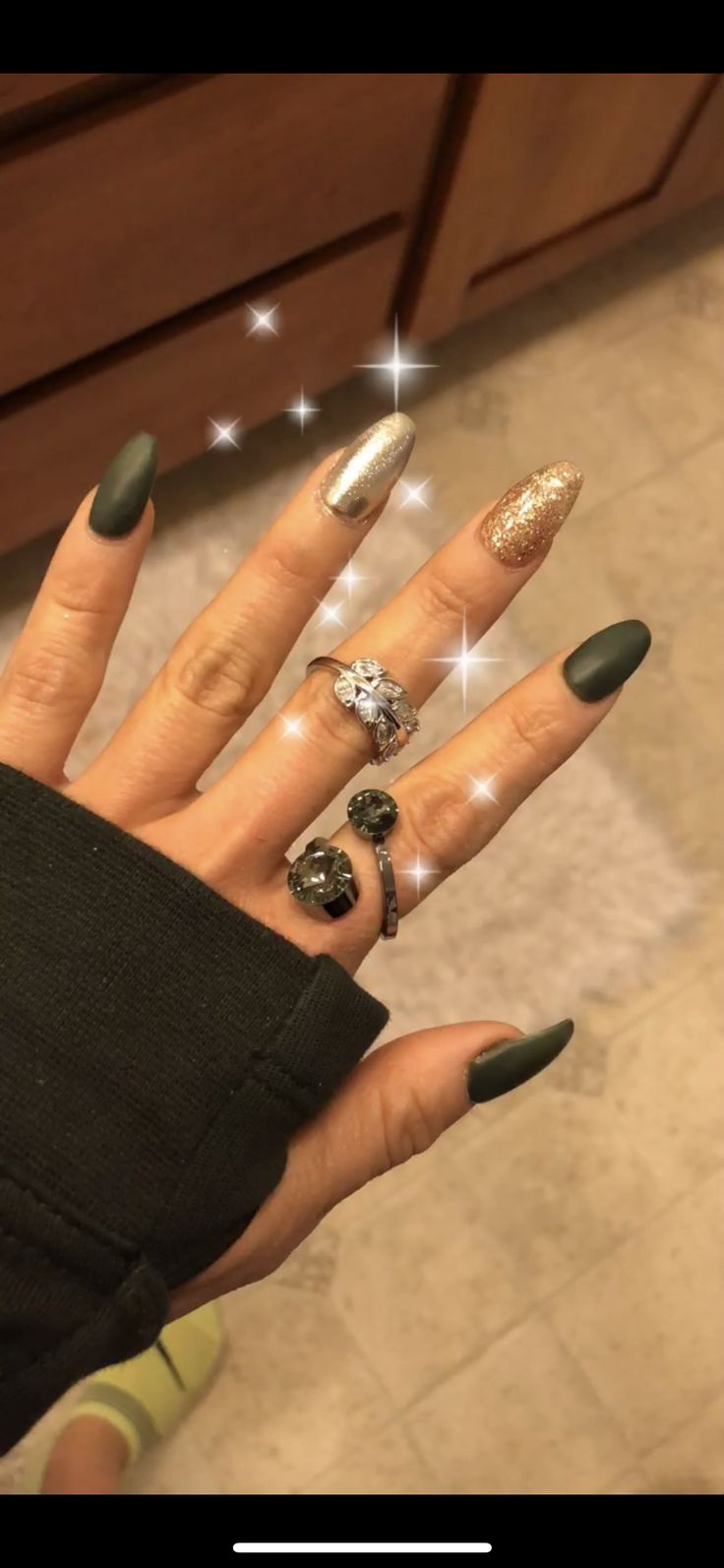 Sophisticated Nail Design: Deep Green Matte with Shimmering Silver and Gold Accents.