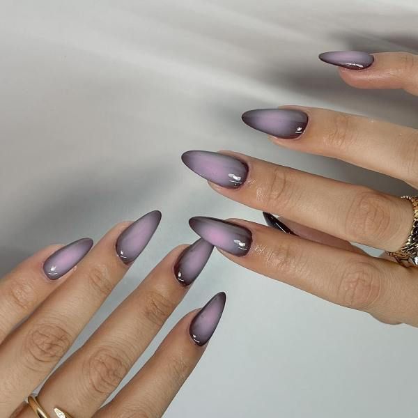 Chic Ombre Nail Design: Lavender to Deep Purple Gradient with Elegant Almond Shape and Glossy Finish.