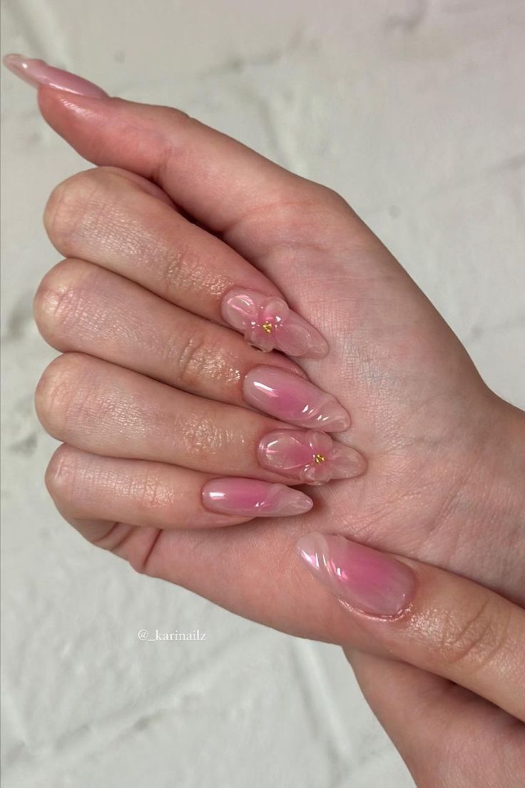 Chic Soft Pink Gradient Nails with Floral Accents and Glossy Finish