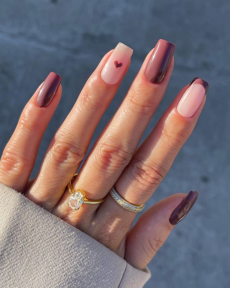 Chic Burgundy and Nude Nail Design with Heart Accent for Any Occasion