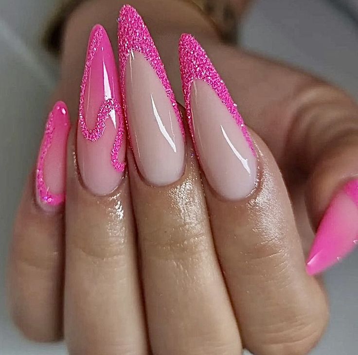 Vibrant Pink Gradient Stiletto Nails with Shimmering Glitter and Playful Wave Accents.