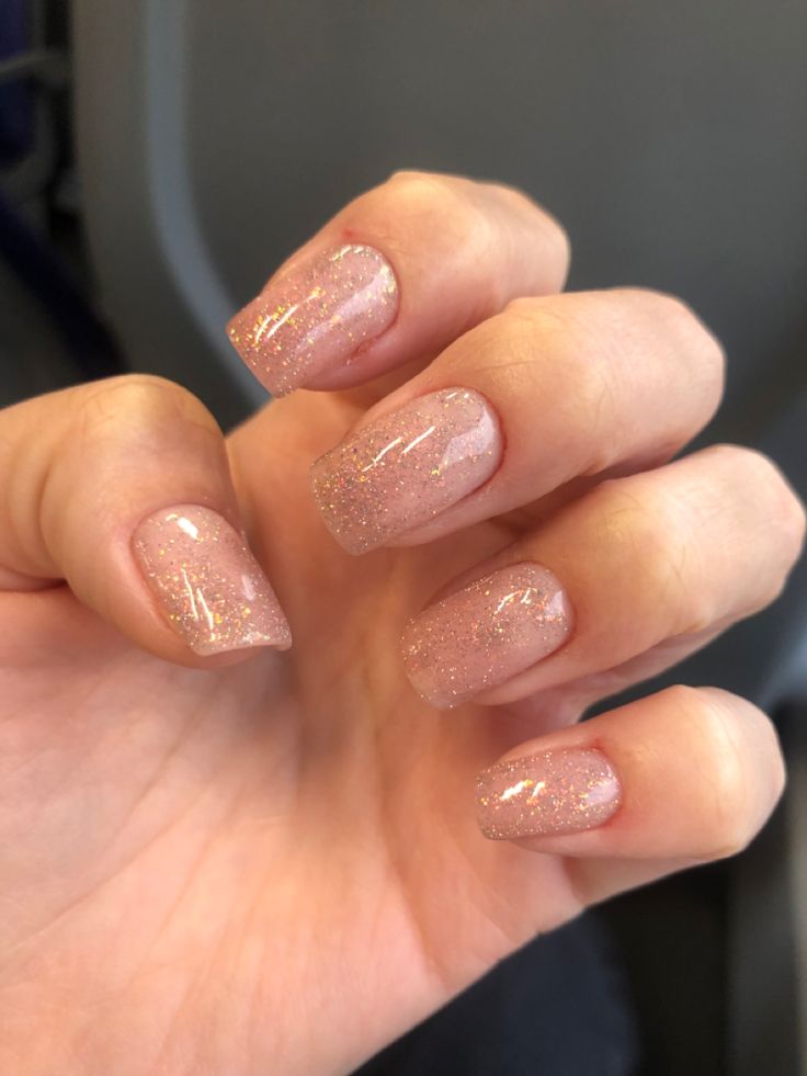 Chic Soft Pink and Glitter Gradient Nails: A Trendy Choice for Any Occasion.