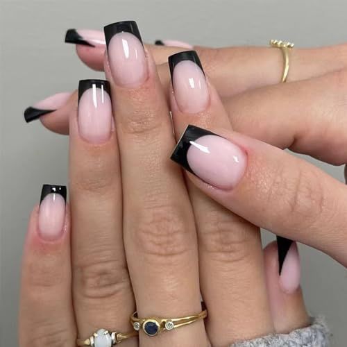 Chic French Manicure Twist: Bold Black Tips on Soft Nude Base.