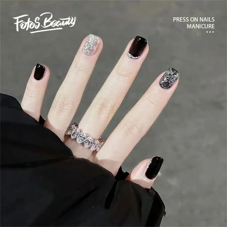 Glamorous Manicure: Glossy Black and Sparkling Silver with Intricate Designs