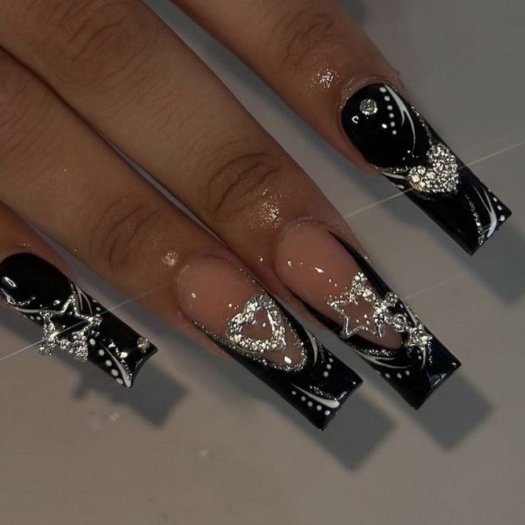 Elegant Black and Nude Nail Design with Cosmic Silver Embellishments