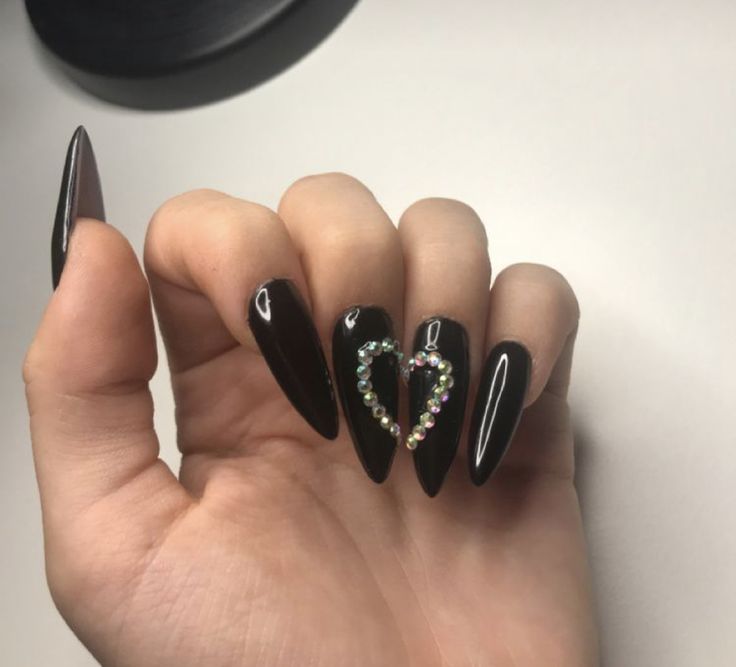 Chic Black Stiletto Nails with Sparkling Heart Design for Bold Glamour.